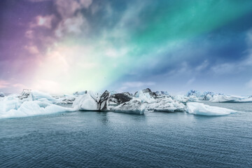 Wall Mural - Northern lights aurora borealis over Jokulsarlon glacier ice lagoon in Iceland