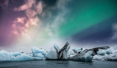 Wall Mural - Northern lights aurora borealis over Jokulsarlon glacier ice lagoon in Iceland