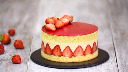 Sponge cake with strawberries and vanilla cream. Strawberry Fraisier cake .