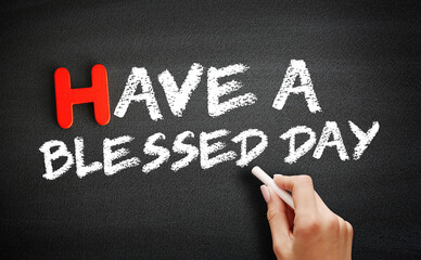 Have a Blessed Day text on blackboard, concept background
