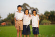 © Torychemistry - Children of student and wearing uniform playing in rice field on morning of countryside