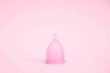 Fototapeta Lawenda - Menstrual cup on pink background. Alternative feminine hygiene product during the period. Women health concept