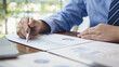 © Puwasit Inyavileart - Financial businessmen analyze the graph of the company's performance to create profits and growth, Market research reports and income statistics, Financial and Accounting concept.