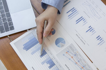 Financial businessmen analyze the graph of the company's performance to create profits and growth, Market research reports and income statistics, Financial and Accounting concept.