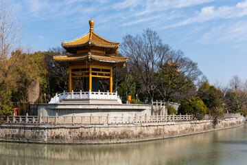 Wall Mural - Traiditonal Chinese pavilion by Puhui River in the park of Qibao Temple, a historic Buddhist monastery in Qibao Old Town, Minhang District, Shanghai, China.