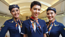 Group Of Cabin Crew Or Air Hostess In Airplane . Airline Transportation And Tourism Concept.