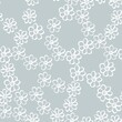 Small white daisies on a gray background. Seamless vector pattern for fabric and wallpaper.