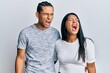 © Krakenimages.com - Young latin couple wearing casual clothes angry and mad screaming frustrated and furious, shouting with anger. rage and aggressive concept.