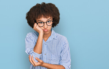 Young hispanic girl wearing business shirt and glasses thinking looking tired and bored with depression problems with crossed arms.