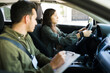 © AntonioDiaz - Young man writing the score of a teen driver