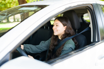 Wall Mural - Caucasian teen girl celebrating after her driving exam