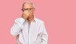 © Krakenimages.com - Senior caucasian man wearing business shirt and glasses tired rubbing nose and eyes feeling fatigue and headache. stress and frustration concept.