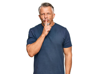 Sticker - Middle age grey-haired man wearing casual clothes asking to be quiet with finger on lips. silence and secret concept.