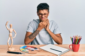 Poster - Young handsome african american man painter sitting palette and art manikin touching mouth with hand with painful expression because of toothache or dental illness on teeth. dentist