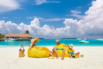 Wall Mural - Family with three year old boy on beach