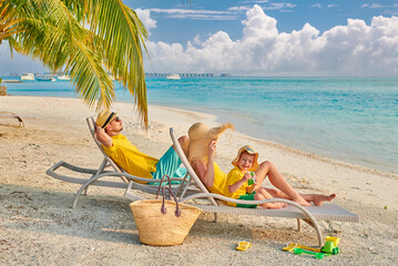 Wall Mural - Family with three year old boy on beach