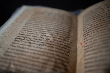 Medieval manuscript hand written on vellum with rubricated and illuminated initials, from a religious text from the C13th. 