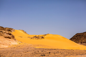 Wall Mural - Beautiful landscape of sand dunes in Egypt. Sahara Desert. Background of orange sand wave. Africa desert