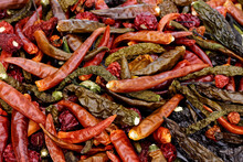Mix Of Dried Chili Peppers. Different Hot Peppers Varieties. Variety Of Shapes And Colors.