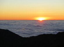 A Sunrise Over The Clouds At The Haleakala Volcano On Maui Island, Hawaii, January