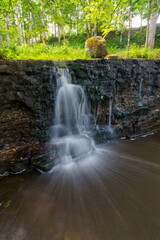 A small waterfall at Renda in the middle of summer.

Ivande waterfall with a small stream of water photographed in a long exposure, which allows the water to flow out.

In the background you can see t