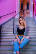 © Nazar - gorgeous girl sitting on the stairs. summer walks through the city streets. rest and relaxation.