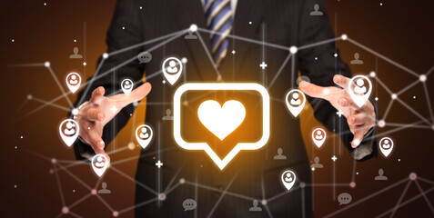 Aufkleber - Hand holdig speech bubble with a heart icon around his hands, Social networking concept