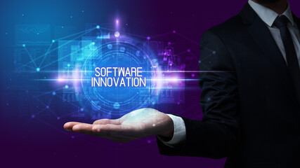 Man hand holding SOFTWARE INNOVATION inscription, technology concept