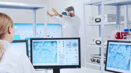 Wall Mural - genetic engineers are using virtual reality technology. professional team of scientists is working o