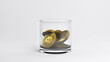 Gold coins fall into a glass goblet.