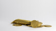 Gold coins lie on a white table. 3D render.
