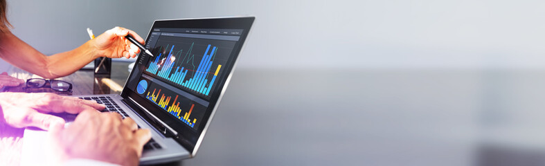 Poster - People Analyzing Graph On Laptop