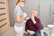 © Yakobchuk Olena - Upset man touching his cheek at the dentist