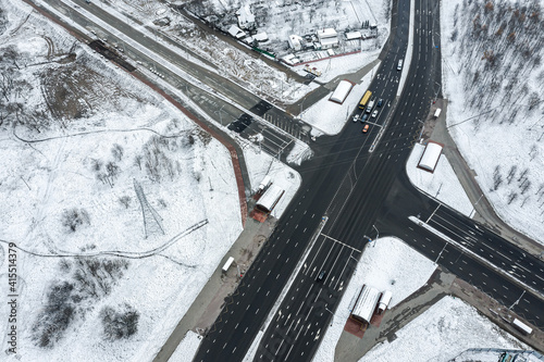 aerial view of a crossroad in the city suburb at chilly winter day