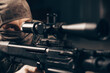 © andy_gin - The sniper lies and aims through the telescopic sight.