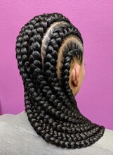Afro Hair Braided In A Cornrow Hairstyle Using Synthetic Hair Extensions With Purple Color Background
