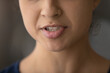 © fizkes - Crop close up of lower face of young Indian woman speak talk. Closeup of millennial mixed race ethnicity female mouth lips, ethnic lady speaker or coach communicate. Diversity, multiracial concept.