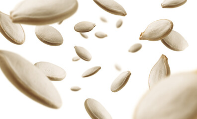 Wall Mural - Pumpkin seeds levitate on a white background