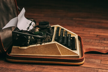 Fototapete - retro typewriter on wooden background and paper decoration texture