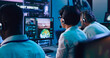 © Framestock - Multiracial operators working in flight control center