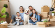 © JenkoAtaman - Happy family with kids and dog moving in new apartment