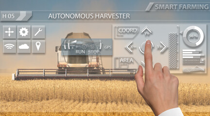 Aufkleber - Remote control of an autonomous combine in the field.  Hand touching screen.