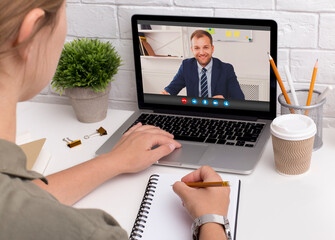 Sticker - Unrecognizable woman using laptop computer in office for remote business meeting