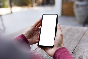 cell phone blank white screen mockup.woman hand holding texting using mobile on desk at office.background empty space for advertise.work people contact marketing business,technology