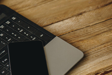 Fototapete - workplace blogger. kit for preparing for public speaking and writing text: laptop and smartphone top view. freelance job