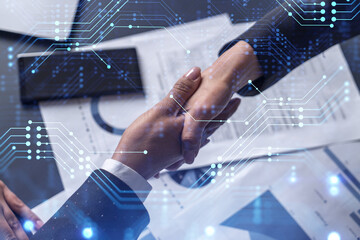 handshake of two businesswomen who enters into the contract to develop a new software to improve bus