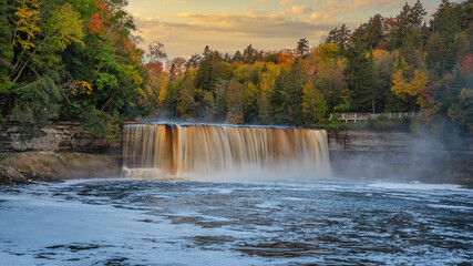 Wall Mural - Dawning day light at Upper Tahquamenon Falls in Autumn - Michigan State Park in the Upper Peninsula - waterfall