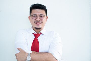 Portrait of a handsome Asian man wearing glasses. Wear a white shirt and red tie.