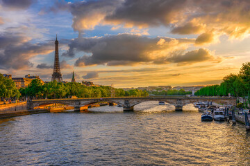 Fototapete - Sunset view of Eiffel tower and Seine river in Paris, France. Eiffel Tower is one of the most iconic landmarks of Paris. Cityscape of Paris