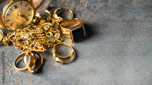 Old and broken jewelry, vintage watches on dark background. Sell  gold  for cash concept.